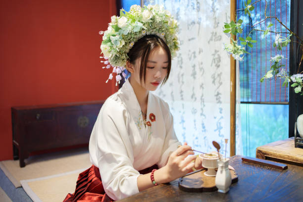 asian female tourists experiencing making aromatherapy